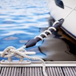 Mooring,At,A,Pier/,A,White,Yacht,Moored,With,A