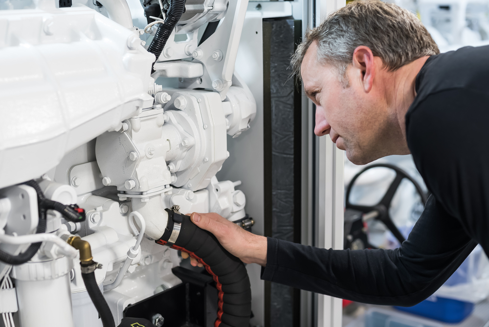 Caucasian,Male,Superyacht,Engineer,Working,On,The,Engine,Room,,Inspecting